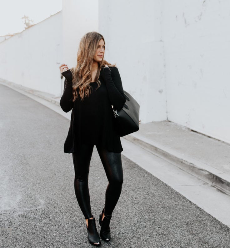 Corrine wearing all black outfit featuring SPANX faux leather leggings