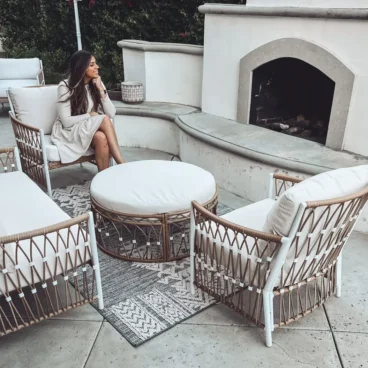 Corrine in the patio enjoying their new outdoor furniture