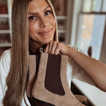 Corrine holding Clemens Chelsea Boot