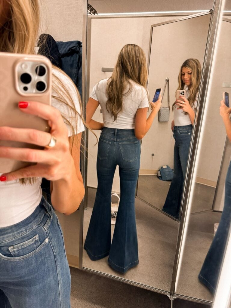 Corrine wearing flare high waist jeans