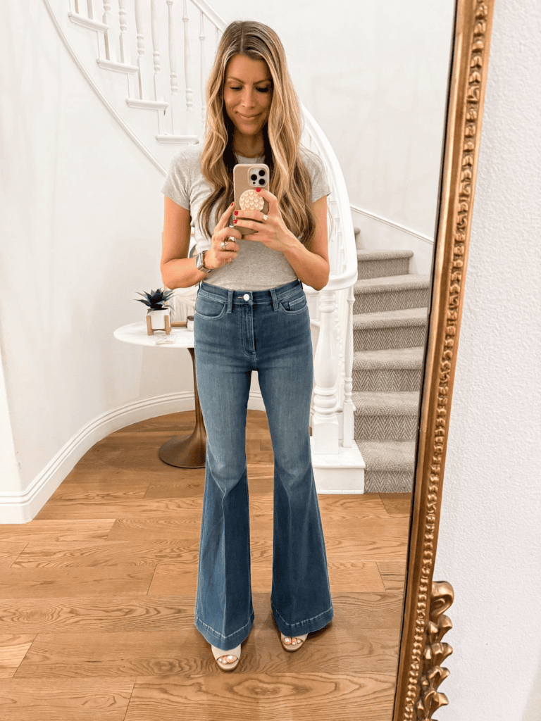 Corrine wearing high waist flare jeans